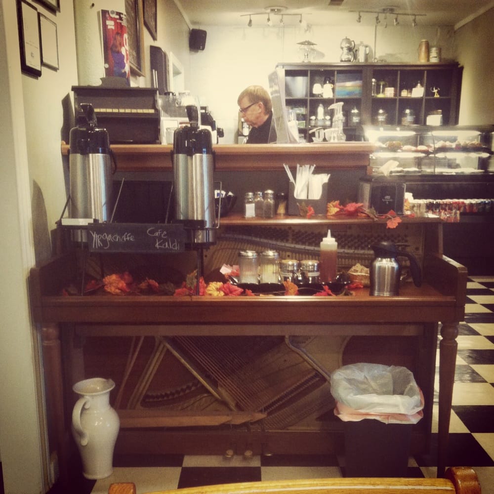 Upcycled piano as the coffee bar. Yelp